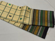 Saraswati- Offwhite with Deep Blackish Brown Handwoven Pure Premium Zariless Korvai Kanjivaram Silk with beautiful neli veldhari checked body with mango and chakram buttas with rich varisaipet borders rich pallu and contrast woven blouse