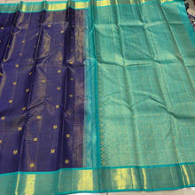 Vaibhogam- Gorgeous Navy Blue with Teal Handwoven Pure 2g Jari Korvai Kanjivaram Silk with Vairaoosi body with mayil chakram motifs woven body with beautiful borders rich pallu and contrast Vairaoosi woven blouse In teal