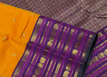 Vaibhogam- Stunning Mambazha Orange (Mango Orange) with Deep Purple Varisaipet Borders with Buttas Handwoven Pure Jari Korvai Kanjivaram Silk with stunning borders rich lakshadeepam style woven pallu and contrast woven beautiful blouse