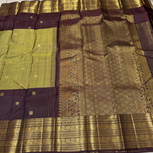 Vaibhogam- Gorgeous Elaichi Green with Coffee Brown Vairaoosi with Buttas Handwoven Pure 2g Jari Kanjivaram Silk with beautiful broad coffee brown borders rich pallu and contrast woven blouse