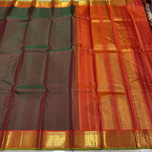Nayaki- Mesmerizing Manthulir Green with Orange Handwoven Pure Kanjivaram Silk with beautiful bawanchi borders with rich pallu and contrast woven blouse