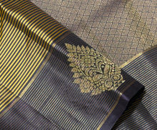 Sahana- Gorgeous Bronze Gold with Blackish Purple Handwoven Pure Jari Kanjivaram Silk with Striped body with rich jarioosi with buttas woven borders beautifully woven pallu and contrast blouse