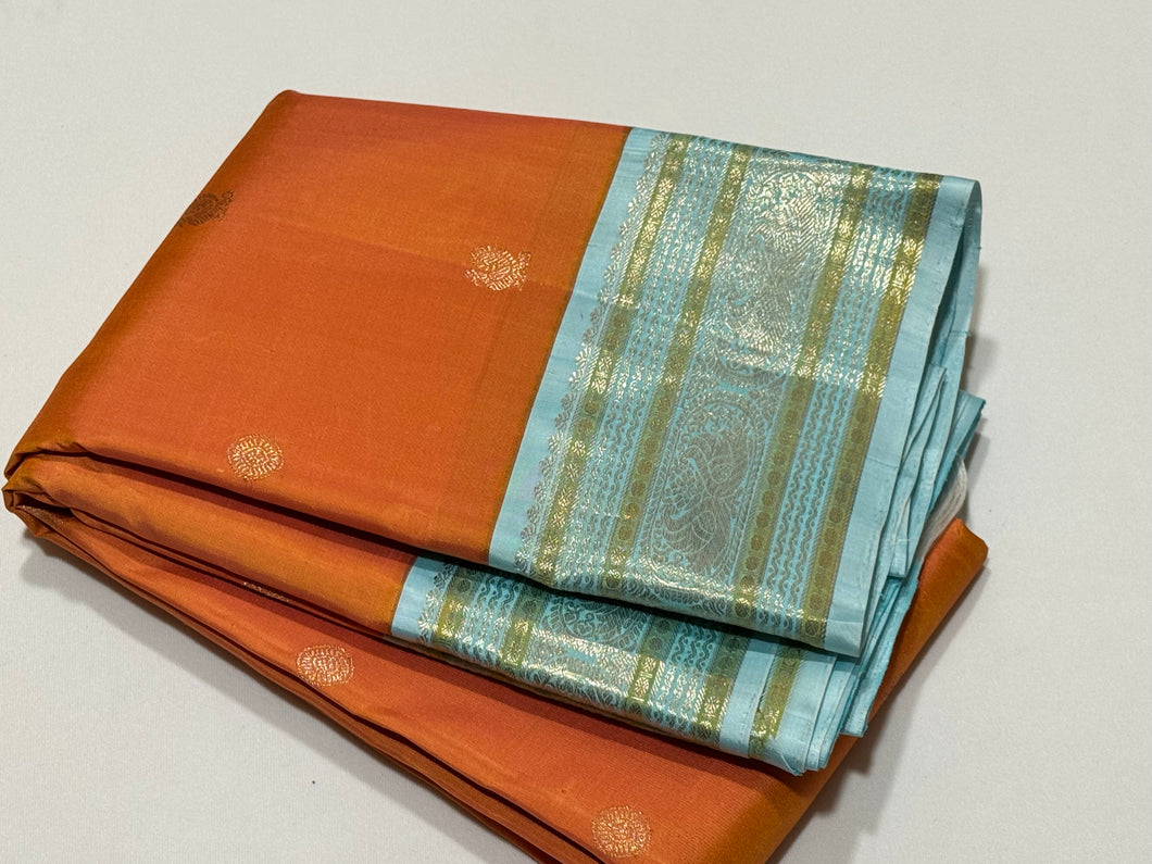 Dual tone Soft Orange with Powder Blue Buttas Handwoven Kai Korvai Kanjivaram Silk Saree with Rich borders pallu and contrast woven blouse beauty