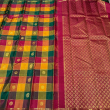 Saranga- Super Gorgeous Handwoven Pure Kanjivaram Silk Saree in a Beautiful Palum Pazhamum Checks with traditional colors with mango and chakram buttas woven in the body with neli veldhari jari lined checks rich woven pallu and contrast arakku red blouse