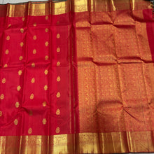 Sahana- Mesmerising Red with Green Handwoven Pure Jari Buttas woven Kanjivaram Silk with beautiful gandaberundas and jewelery motits woven body rich bawanchi borders with green selvedges beautiful pallu with unique motifs woven and contrast green blouse.