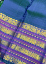 Vaibhogam- Stunning Burnt Orange Red with Peacock Blue Handwoven Pure Jari Korvai Kanjivaram Silk with Plain body rich varisaipet borders beautiful peacock blue pallu and contrast woven blouse