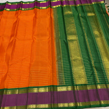 Vaibhogam- Gorgeous Orange with Emerald Green Handwoven Pure Jari Korvai Kanjivaram Silk with beautiful jari veldhari stripes and silk thread striped body with beautiful doublepet borders with rich pallu and contrast woven blouse
