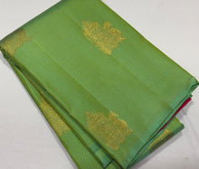 Saranga- Gorgeous Parrot Green with Tomato Pink Handwoven Pure jari borderless Kanjivaram silk with Muthukattam with buttas woven beautiful body with rich pallu and contrast woven blouse
