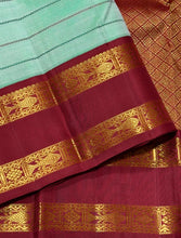 Vaibhogam- Gorgeous Pastel Green with Ganga Jamuna Bottle Green and Arakku Red borders with Neli Veldhari woven beautiful body with fishpet double borders rich pallu and contrast woven blouse