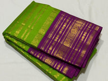 Vaibhogam- Stunning Parrot Green with Purple Handwoven Pure Zari Korvai Kanjivaram Silk with Beautiful Jari Veldhari woven body with rich varisaipet borders gorgeous palli and contrast veldhari stripes woven blouse