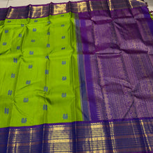 Vaibhogam- Mesmerizing Parrot Green with Violetish Purple Handwoven Pure Jari Korvai Kanjivaram Silk with Pattu buttas woven body with rich borders gorgeous pallu and contrast woven blouse