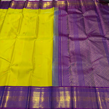 Vaibhogam-Mesmerizing Green Sampanga with Purple Handwoven Pure Jari Korvai Kanjivaram Silk with beautiful mayil chakram buttas woven body with rich gettipet borders rich pallu and contrast woven beautiful blouse