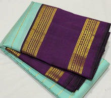 Vaibhogam- Mesmerizing Powder Blue with Deep Purple HandwovenPure jari Korvai Kanjivaram Silk with Jari Veldhari Stripes woven beautiful body with rettapet borders with stunning rich and finely woven pallu and contrast zari striped beautiful blouse