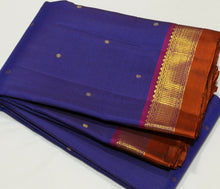 Nayaki- Gorgeous MS Blue with Dark Magenta and Rust Buttas Handwoven Pure Jari Kanjivaram Silk with beautiful buttas woven body with rich borders pallu and contrast woven blouse