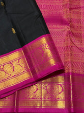 Vaibhogam-Gorgeous Black with Mustard and Rani Pink Ganga Jamuna borders Handwoven Pure Jari Korvai Kanjivaram Silk with Buttas woven beautiful body rich borders pallu and contrast blouse. A stunner for this wedding season !