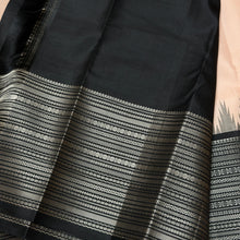 Saraswati-Gorgeous Handwoven Pure Zariless Korvai Kanjivaram Silk in a beautiful and rare peachish sandal shade with Black combination with beautiful kasuti style buttas woven beautiful body with varisaipet borders rich pallu and contrast woven blouse