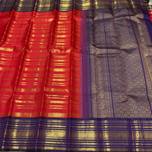 Vaibhogam- Gorgeous Red with Deep Blue Handwoven Pure 2g Jari Kanjivaram Silk with beautiful Jari veldhari striped body with different patterns rich varisaipet borders gorgeous pallu and contrast deep blue jari woven blouse