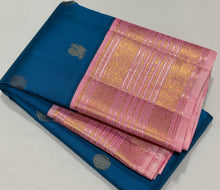 Vaibhogam- Gorgeous Peacock Blue with Soft Pink Handwoven Pure Jari Korvai Kanjivaram Silk  with mayil chakram buttas woven body with rich meenakari borders beautiful and intricately woven pallu and contrast woven blouse