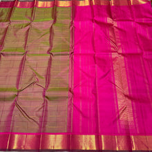 Sahana-Beautiful Dual tone Manthulir Green with Rani Pink Combo in a Handwoven Pure Kanjivaram Silk with Neli Veldhari Striped Body with beautiful mayilkan borders with green selvedges rich seer pallu and contrast woven pink blouse