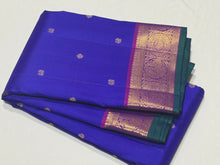 Royal Blue with Purple Buttas Handwoven Pure Jari Kanjivaram Silk Saree with rich buttas woven body , intricate mayil chakram buttas woven borders, gorgeous pallu and contrast woven blouse