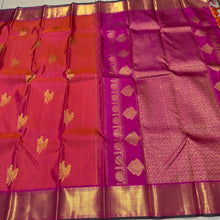 Vaibhogam -Gorgeous Dual tone Orange with Pink with Double Bird Buttas Handwoven Pure Jari Kanjivaram Silk with muthukattam woven body with rich bawanchi borders with green selvedges beautiful pallu with floral buttas woven with contrasting pink blouse