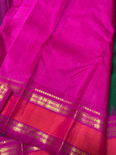 Sarasangi-Stunning Bottle Green with Rani Pink Handwoven Pure Jari Korvai Kanjivaram Silk with Fishpet Borders with temples woven with rich seer pallu and contrast woven blouse.