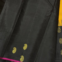 Gorgeous Mustard with Black Podikattam Checked Body with Beautiful Paisleys and small temples woven double side borders with dark Magenta Selvedges with Rich Seepu Seer Pallu and Contrast woven blouse