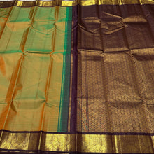 Sarasangi- Gorgeous Dual tone Green shot with mustard body with deep brown combination in a handwoven Pure Jari Korvai Kanjivaram Silk with beautiful borders rich pallu and contrast woven blouse