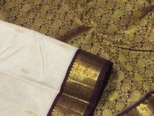 Offwhite with Coffee Brown Handwoven Pure Jari Korvai Kanjivaram Silk Saree with rich beautiful yazhis and peacocks woven borders rich pallu and contrast woven blouse