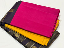 Vaibhogam- Stunning Deep Kanchana Blackish Purple with Yellow and Rani Pink Combination with Vairaoosi and middle thick strips where mayil chakram motifs are woven with beautiful broad ganga jamuna borders with rich pallu and contrast vairaoosi blouse
