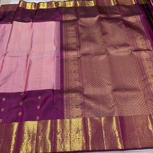 Vaibhogam- Mesmerizing Lotus Pink with Dark Magenta Purple Handwoven Pure 2g Jari KanjivaramSilk with Jarioosi checked body with beautiful mayil chakram motifs woven middle borders with beautiful long and short lower borders pallu and contrast wove blouse