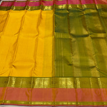 Sahana- Gorgeous Sunshine Yellow with Muthukattam Handwoven Beautiful Pure Jari Kanjivaram Silk with beautiful peachish pink with Olive Green spaced borders rich olive green pallu and contrast woven blouse