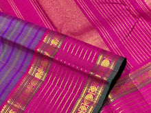 Sahana-Stunning Double tone Blue Green body with striped purple and green lines with gorgeous veldhari striped rettapet borders rich pink seer pallu and contrast woven blouse