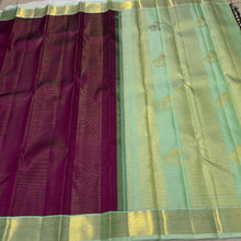 Vaibhogam- Mesmerizing Deep wine with pastel green Handwoven Pure 2g Jari Korvai Vairaoosi body with beautiful yazhis and annapakshis woven borders rich yazhi buttas woven beautiful pallu and contrast woven blouse