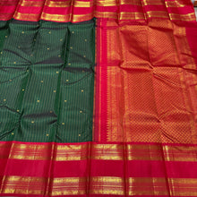 Vaibhogam-Super Gorgeous Bottle Green with Red Handwoven Pure Jari Korvai with oosi vanam lines with Rudraksha buttas woven all over body with Doublepet Rich Borders with rich and finely woven beautiful Pallu and Contrast woven red blouse