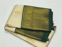 Stunning Ivory white with bottlegreen Handwoven Pure Jari Korvai Kanjivaram Silk Saree with gorgeous Gandaberunda motifs woven body rich borders pallu and contrast woven blouse