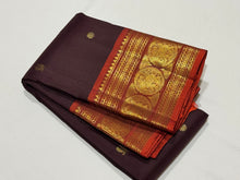 Gorgeous Chocolate Brown with Burnt Orange Handwoven Pure Kanjivaram Silk Saree with beautiful buttas rich borders and pallu woven body with a contrast woven blouse