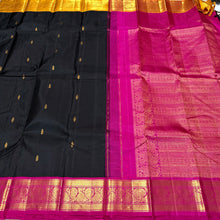 Vaibhogam-Gorgeous Black with Mustard and Rani Pink Ganga Jamuna borders Handwoven Pure Jari Korvai Kanjivaram Silk with Buttas woven beautiful body rich borders pallu and contrast blouse. A stunner for this wedding season !