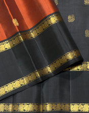 Sahana- Stunning Rust with Black Buttas Handwoven Pure Kanjivaram Silk with beautiful buttas woven body with doublepet borders rich buttas woven pallu and contrast woven blouse