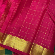Sahana-Stunning Palum Pazhamum Checks with Beautiful Traditional set of shades with gorgeous jari checked body with mayil chakram buttas woven with bawanchi borders rich arakku pallu and contrast arakku blouse. A beautiful piece for this wedding season!