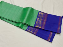Sarasangi- Beautiful Pastel Green with Royal Blue Handwoven Pure Jari Korvai Kanjivaram Silk with beautiful borders rich seer pallu and contrast woven blouse