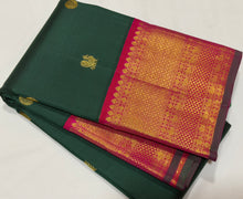 Vaibhogam- Stunning Bottle Green with Tomato Orange Pink Handwoven Pure 2gram Jari Korvai with Mayil Chakram Buttas Kanjivaram Silk with rich borders beautiful pallu and contrast woven blouse