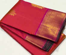 Vaibhogam -Gorgeous Dual tone Orange with Pink with Double Bird Buttas Handwoven Pure Jari Kanjivaram Silk with muthukattam woven body with rich bawanchi borders with green selvedges beautiful pallu with floral buttas woven with contrasting pink blouse