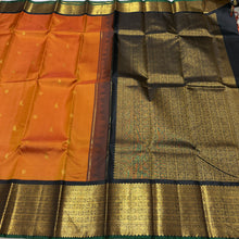 Vaibhogam- Stunning Rust with Black Handwoven Pure 2g Jari Korvai Kanjivaram Silk with mayil kuyil bird buttas with rich borders gorgeous pallu and contrast woven blouse