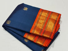 Vaibhogam-Stunning Deep Peacock Blue with Orange Handwoven Pure Jari Korvai with Elephant and Annapakshi Buttas woven Kanjivaram Silk Sarees with Intricate Meenakari Woven Borders Rich Pallu and Contrast woven blouse