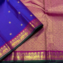Sahana- Violetish Blur with Magenta Pink Buttas Handwoven Pure Jari Kanjivaram Silk with elephants and peacocks motifs woven body with beautiful borders with green selvedges rich pallu and contrast woven blouse