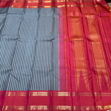 Gorgeous Handwoven Pure Jari Korvai Kanjivaram Silk Saree with greyish blue and dark grey striped body with gorgeous dual tone kanakambaram orange pink rettapet rudrakshas woven borders rich temple rekku pallu and contrast woven blouse