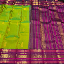 Vaibhogam- Mesmerising Parrot Green with Deep Magenta Handwoven Pure Jari Korvai Buttas Woven Kanjivaram Silk with beautiful varisaipet borders gorgeous pallu and contrast woven blouse