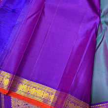 Sahana- Gorgeous Dual tone Lavendarish Blue with Purple Small Borders with orange selvedges with Buttas Handwoven Pure Jari Kanjivaram Silk with rich pallu and contrast woven blouse