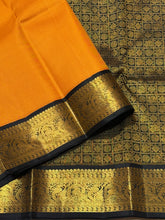 Sarasangi - Gorgeous Mustard with Black Handwoven Pure Jari Korvai Kanjivaram Silk with beautiful black double parrots woven borders with rich pallu and contrast woven blouse